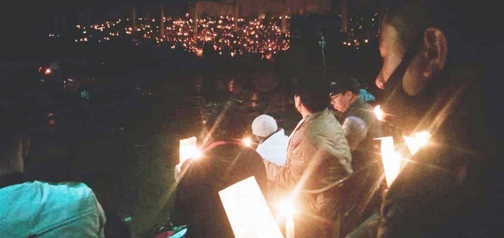 Participants during the candlelight vigil held in honour of the three individuals who were killed by armed assailants on March 22. The event organised by the Zeliangrong Students’ Union Kohima, was scheduled to be held at Old MLA Hostel junction on March 31. However, due to inclement weather, the venue was shifted to local ground Kohima. (Morung Photo)        